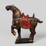 A large Tang dynasty-style horse with polychrome painting and gilding.
100 x 105 cm.