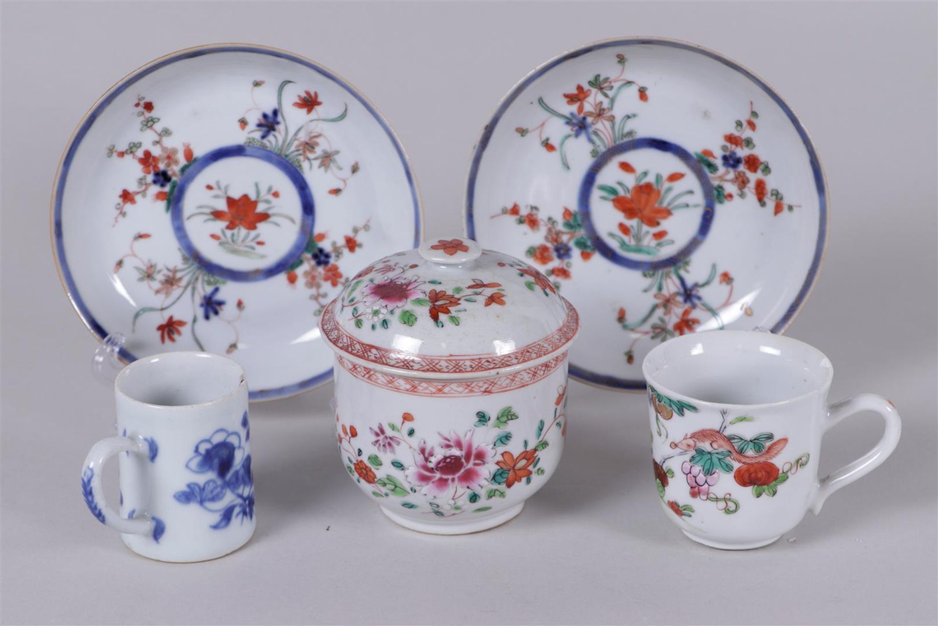 A lot of various porcelain Famille Rose objects including a sugar bowl, (2) cups and (2) saucers.