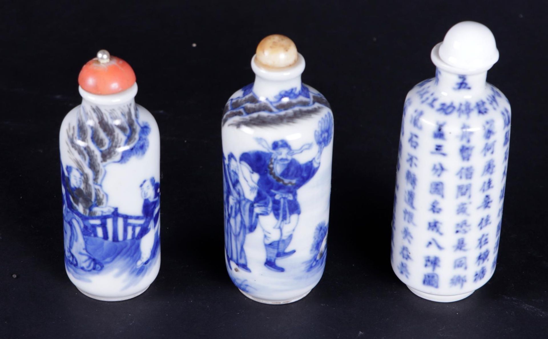 A lot of three porcelain snuff bottles with various decors, marked on the bottom. China, 19th centur