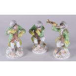 A set of three Meissen style porcelain figures "monkey band", marked N. Dresden, 20th century.
H. 17