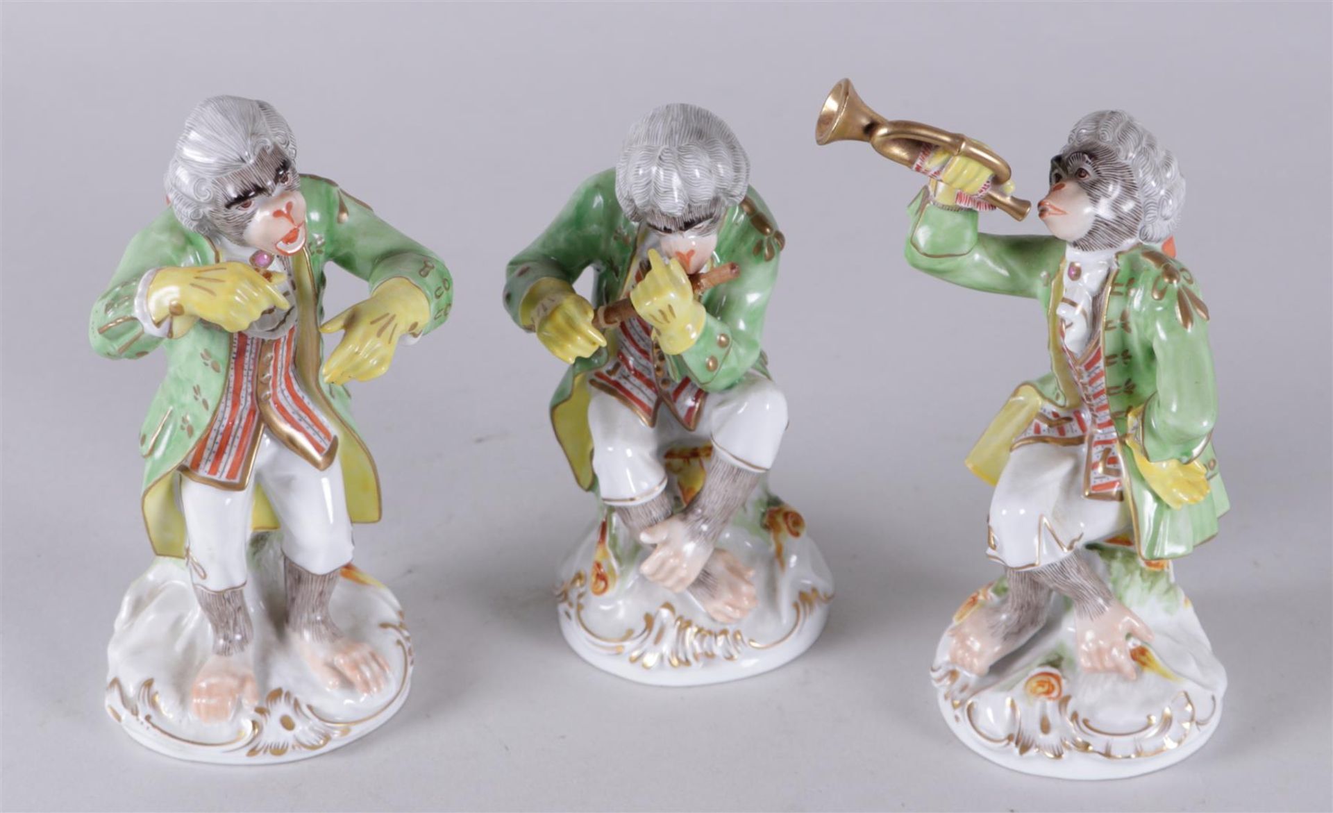 A set of three Meissen style porcelain figures "monkey band", marked N. Dresden, 20th century.
H. 17