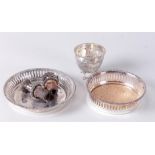 A lot with two base bottle trays and two silver filigree bottle stoppers.