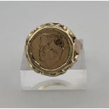 14kt/9kt yellow gold American signet ring with coin. 
The coin depicts John Fitzgerald Kennedy. The 