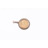14kt Yellow gold coin pendant. The coin is a copy of a 5 guilder coin from 1912 depicting Queen Wilh