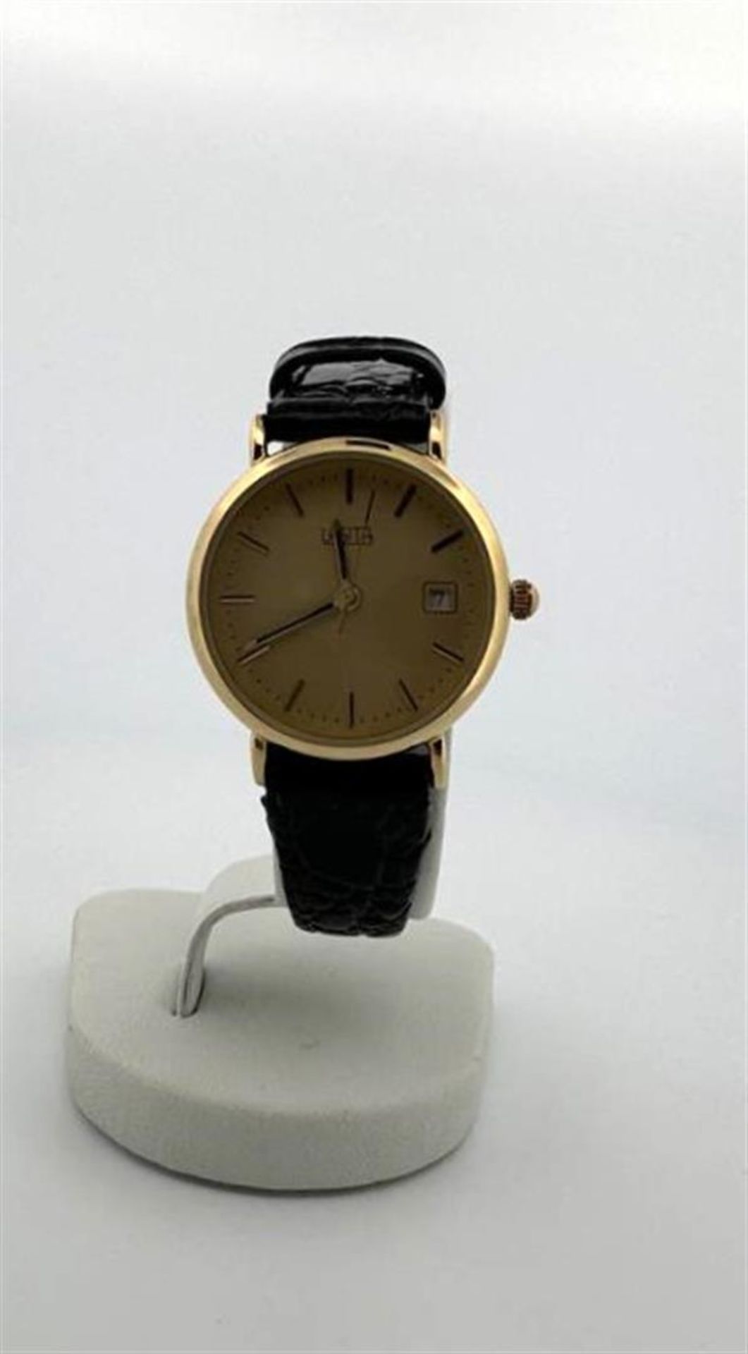 14kt Yellow gold Lasita women's watch with champagne-colored dial.
Number indication: dashes and dat