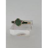 14kt yellow gold shoulder ring set with green emerald and diamond. 
The ring has a beautiful openwor