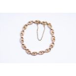 14kt yellow gold coffee bean link bracelet. 
The bracelet is finished with a beautiful ornate clasp 