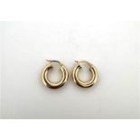 14 kt yellow gold hollow hoop earrings.
Inside diameter: 10.3 mm. 
Outside diameter: 20.2 mm.
Creole