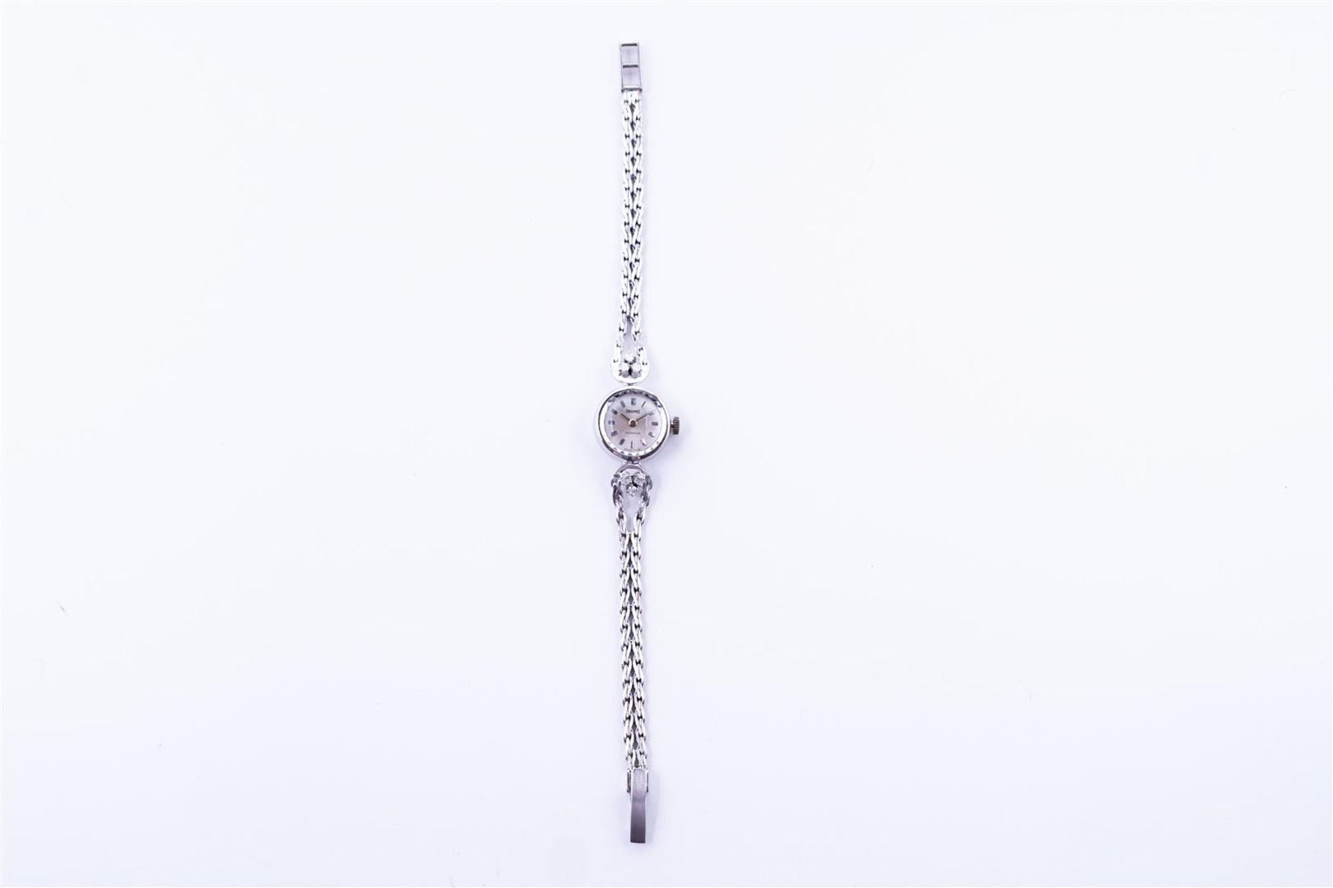 14kt white gold Precimax Incabloc ladies watch set with diamonds.
The watch has a beautiful white go