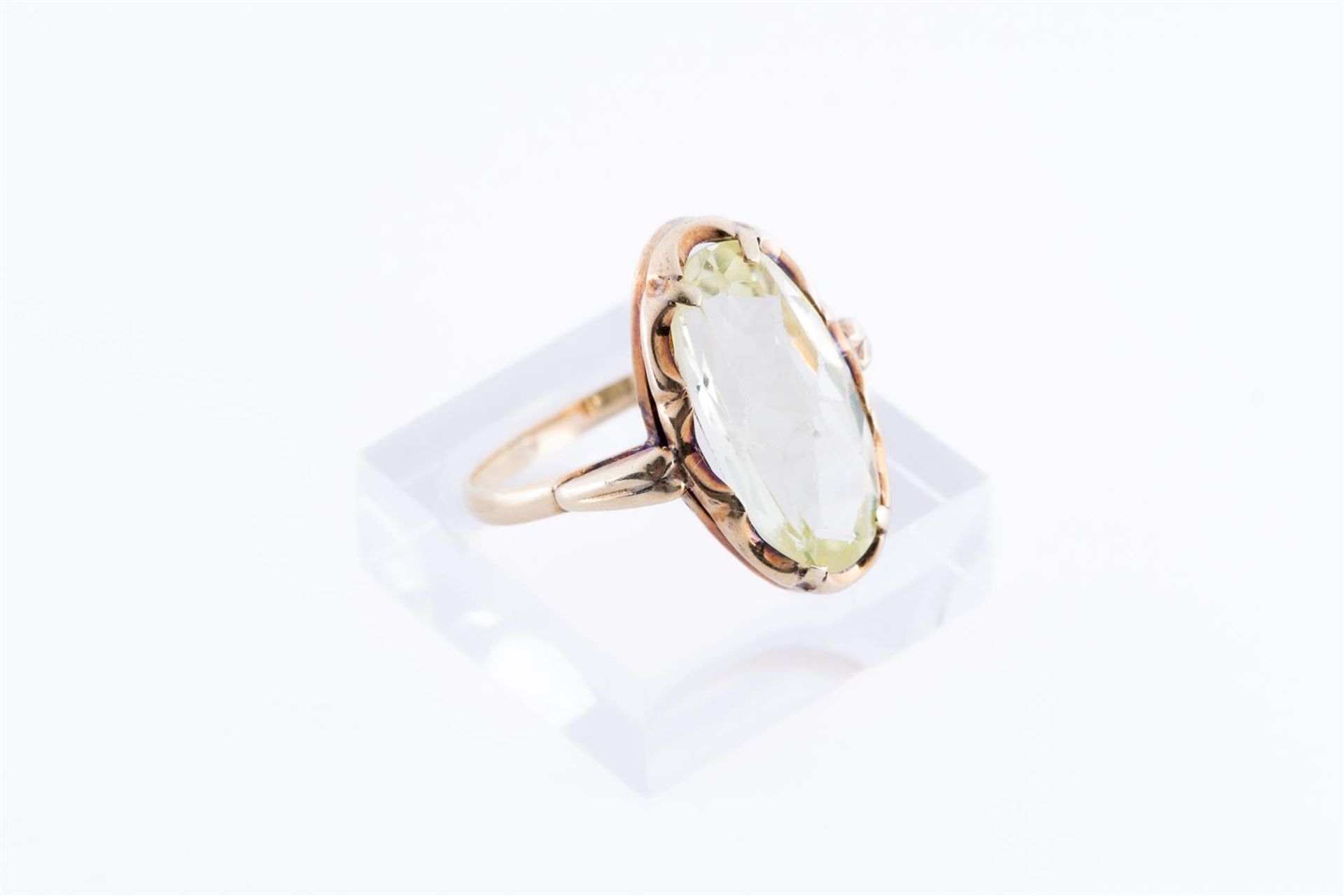 18kt Yellow gold ring set with one oval cut imitation peridot. 
Stone dimensions: 17.5 mm x 9.2 mm
R