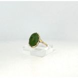 14kt yellow gold ring set with nephrite jade.
The ring is set with an oval cabochon cut nephrite jad
