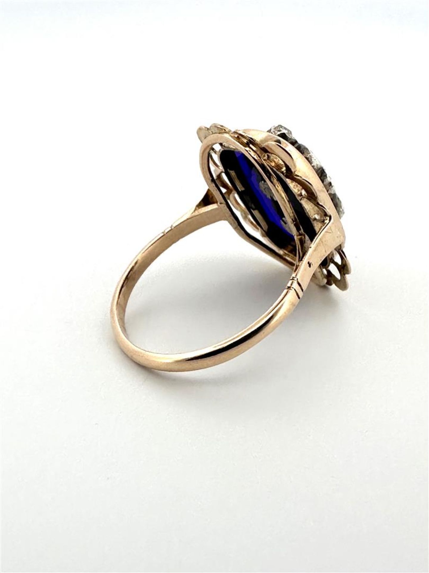 14kt bicolor gold antique appliqué ring with openwork scalloped edge, blue glass and rough diamond.
 - Image 5 of 5