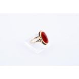 14kt yellow gold ring set with imitation carnelian.
The ring is set with 1 oval-faceted imitation ca