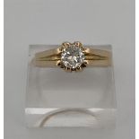 18kt yellow gold solitaire / pinky ring set with diamonds. 
The ring is set with 1 brilliant cut dia