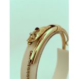 14kt rose gold antique snake slave bracelet / esclave / bangle set with garnet and glass.
The bracel