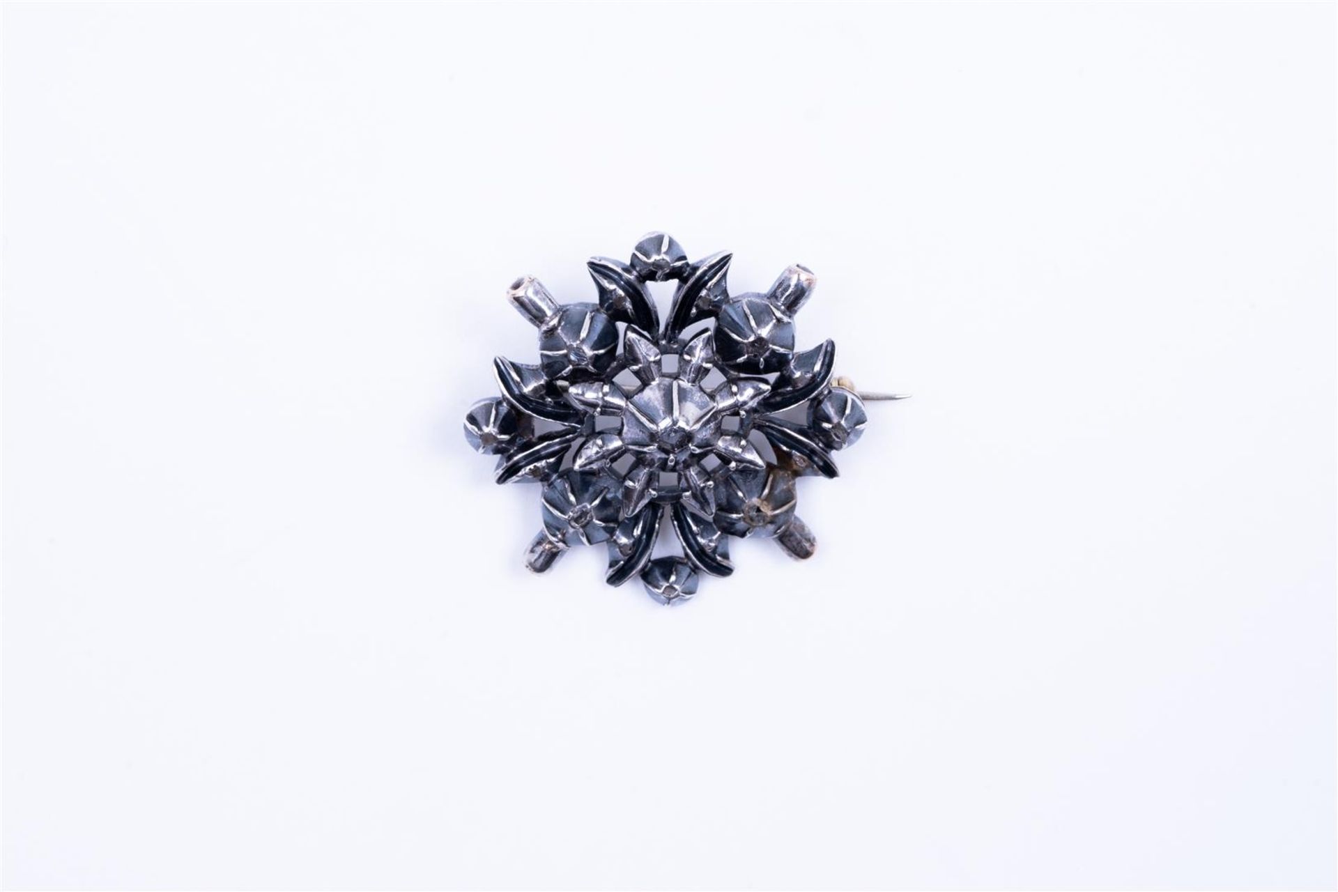 Silver brooch set with rough diamonds. 
Diamond quality P3 Colour: dark gray
Weight 10.8 grams.
 Hal