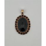 14kt rose gold pendant set with garnet.
The pendant features 1 oval faceted garnet of approx. 24.3 x