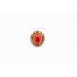 14kt yellow gold brooch/pendant set with red coral.
This piece of jewelry can be worn as a brooch or