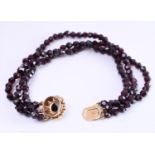 14 kt rose gold bracelet with 3 strands of faceted garnet beads and rose cut garnet gemstones. The b