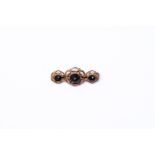 14 kt Gold brooch set with 3 rose cut garnet gemstones. 
Matching bracelet and necklace: 1427-002 + 