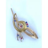 14kt bicolor gold brooch set with syn. ruby and syn. blue spinel.
The brooch is made in 14kt yellow 