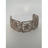 Silver filigree bracelet.
Beautiful wide bracelet with filigree and hook clasp. The bracelet is a re