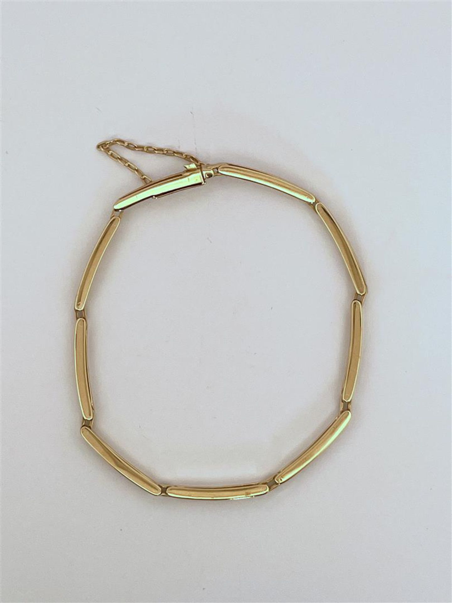 14kt yellow gold bars link bracelet.
Nice bracelet to hang charms on. The bracelet has a sturdy box 