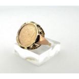 14kt yellow gold American signet ring with coin. 
The coin depicts John Fitzgerald Kennedy. 1961-196