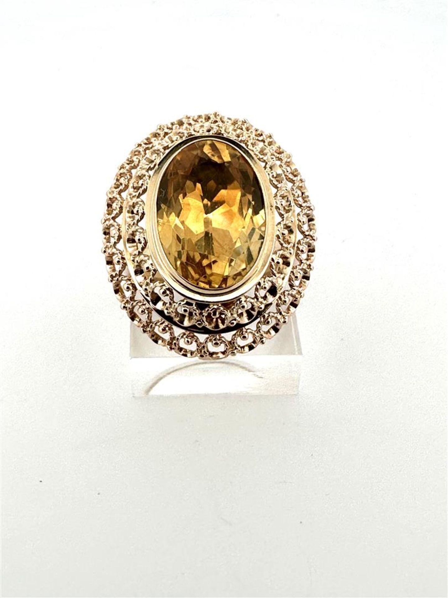 14kt yellow gold statement cocktail ring with citrine. 
The ring has a beautiful openwork double edg