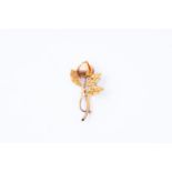 14kt Bicolor gold brooch in the shape of a rose. The bud of the rose is made in rose gold and the le