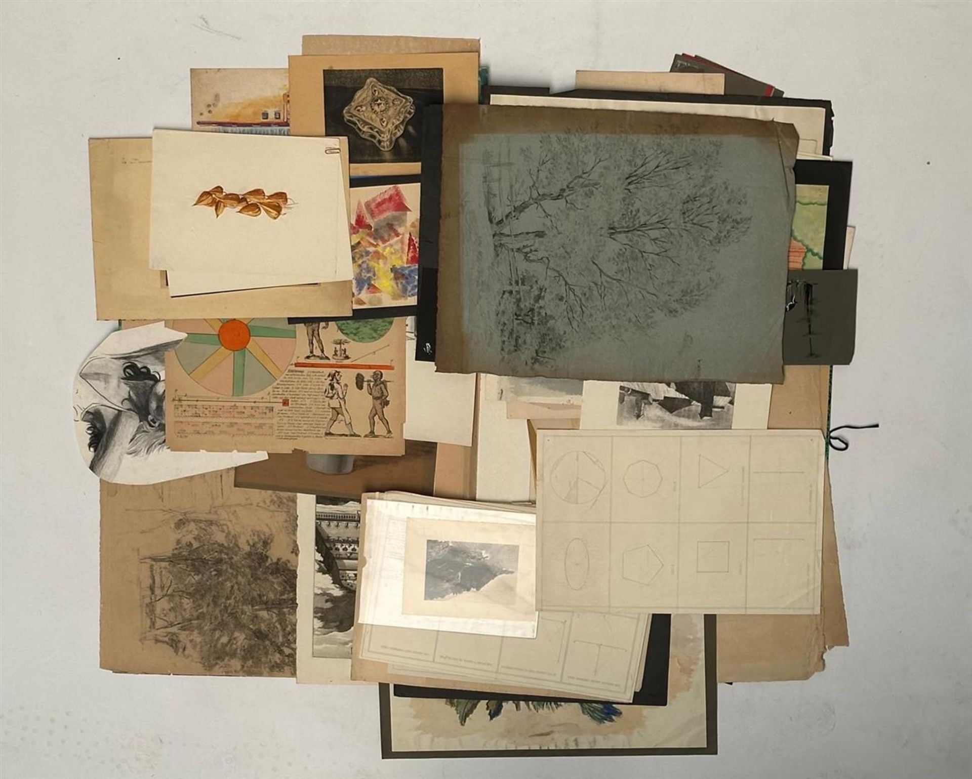 A folder with various drawings and prints.