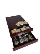 A collection of various coins including Royal House and ECU.