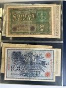 A collection of various German banknotes.