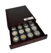 A collection of 23 gilded coins on the subject of the Royal Family.