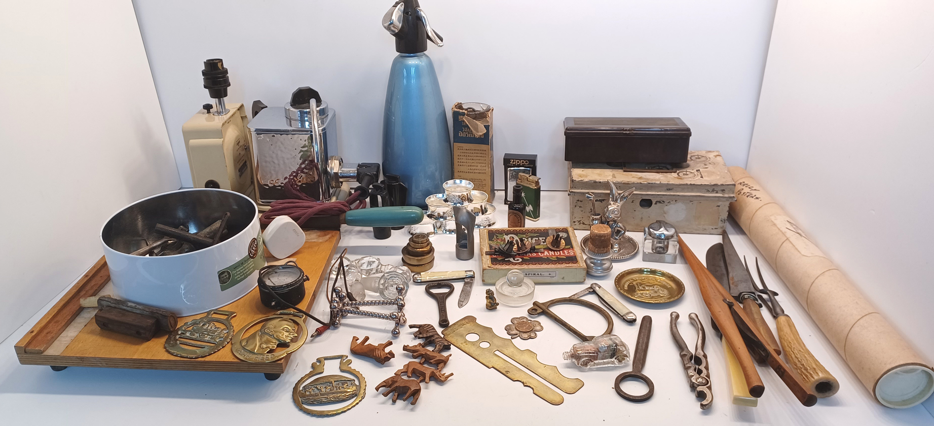 A BAKOLITE HINGED BOX, A CASH TIN WITH MAINLY FOREIGN COINS AND A GUILLOTINE