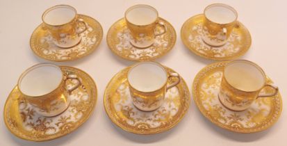 6 COFFEE CANS AND SAUCERS IN GOLD PATTERN