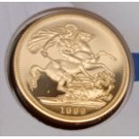 A Queen Elizabeth II Royal Mint 1999 Gold Sovereign on large Commemorative Cover, celebrating Earl &