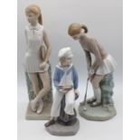 3 LLADRO'S - BOY HOLDING YACHT, GIRL PLAYING GOLF AND GIRL PLAYING TENNIS