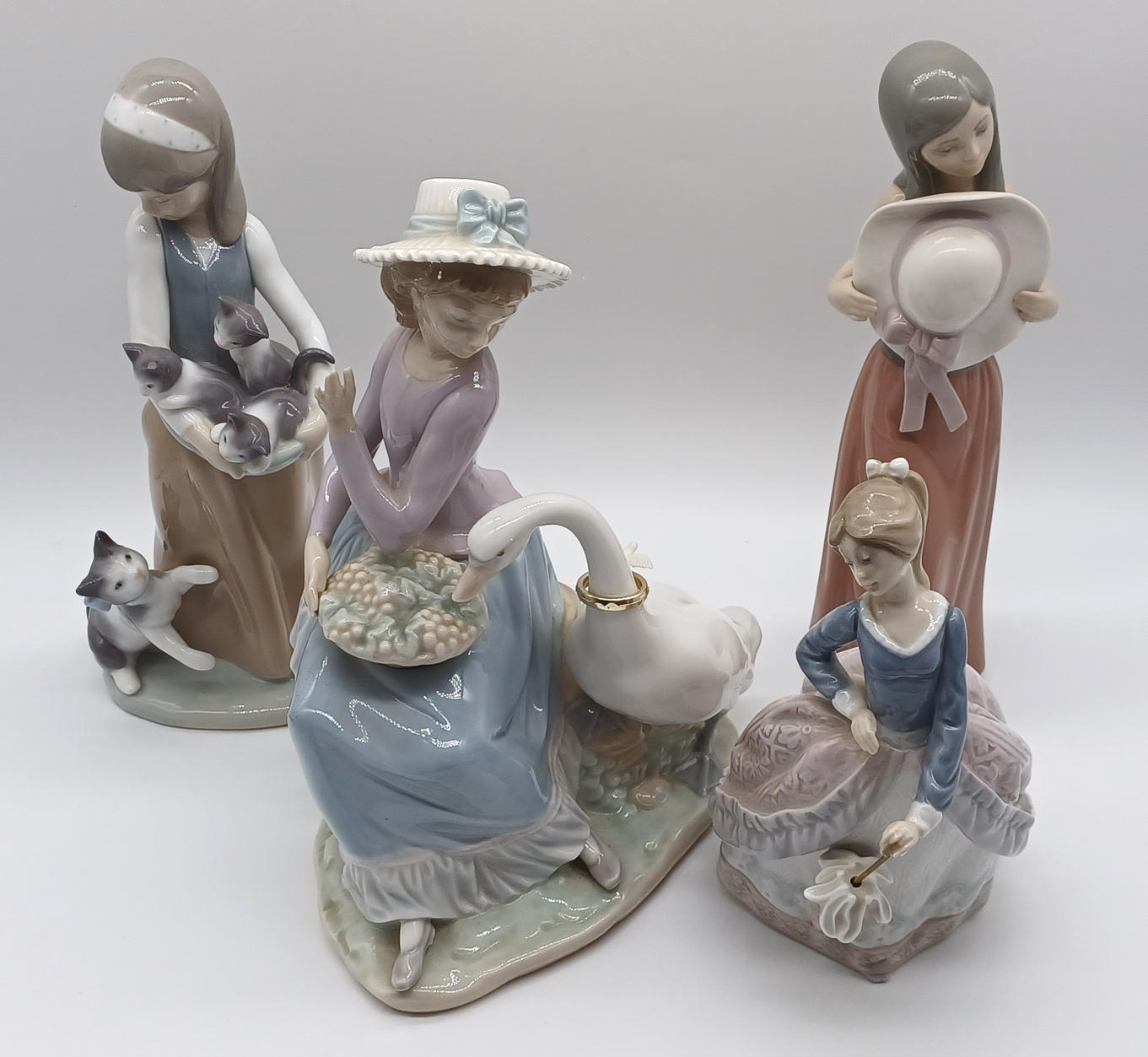 4 LLADRO - GIRL WITH GOOSE, GIRL HOLDING AN UMBRELLA, GIRL HOLDING A HAT, GIRL HOLDING KITTENS