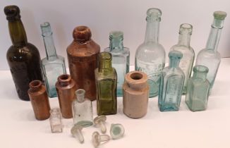 COLLECTION OF VINTAGE GLASS AND STONEWARE BOTTLES (15)