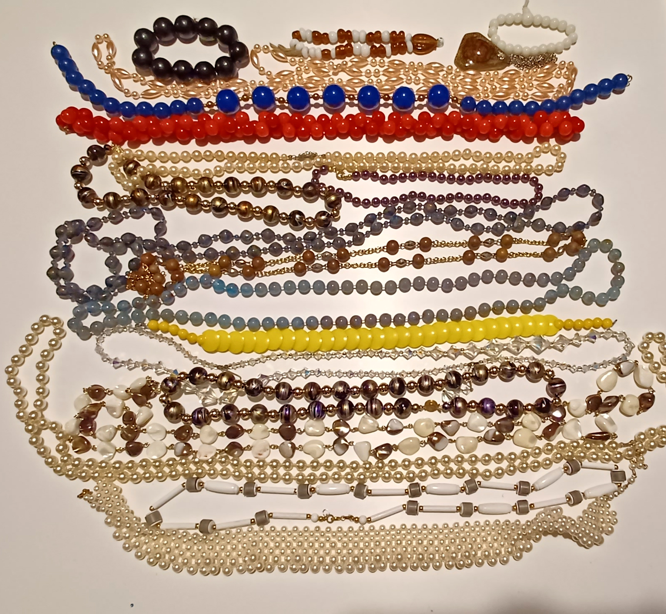 BAG OF BEADED NECKLACES AND BRACELETS