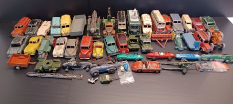A COLLECTION OF PLAYWORN DINKY TOYS
