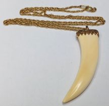 9CT GOLD TOOTH PENDANT APPROX 5.5CM CHAIN 22" TOTAL WEIGHT 10.5g