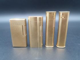 Four Dunhill Cigarette Lighters in gold plated cases