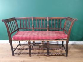 A 19th Century fruitwood Settee with reeded bar back, rush seat (also including a cushion) and