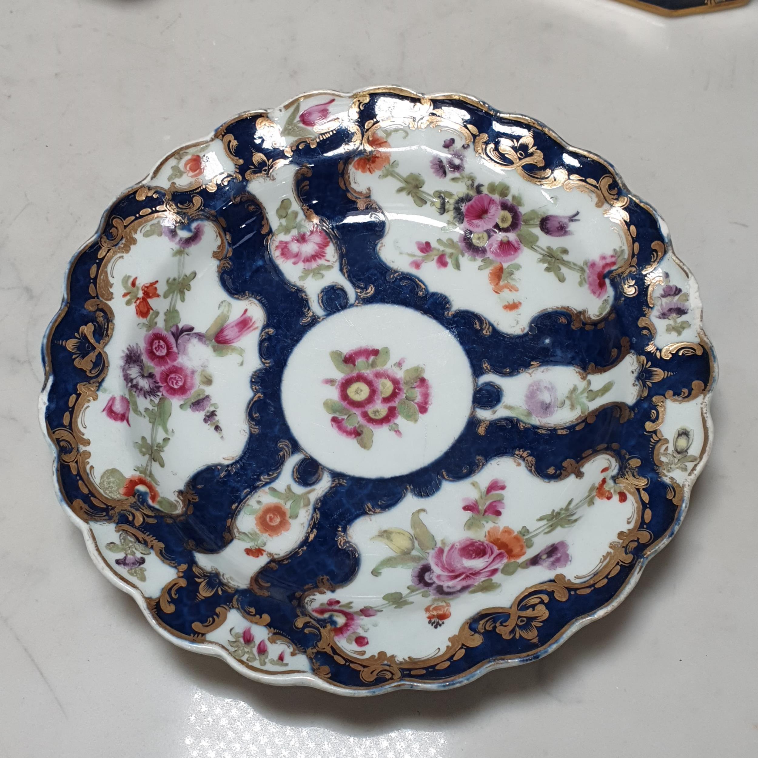 A Worcester Plate with shaped rim, floral panels with blue and gilt borders, surface scratches, - Image 2 of 5