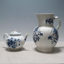 A Worcester blue and white globular Teapot decorated floral sprays and butterflies, flower finial,