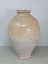 A Chinese buff pottery Vase with partial clear glazing possibly Tang Dynasty, 11.5"High.