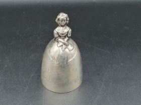 A George V silver Crinoline Bell with engraved decoration, the clappers modeled as two legs,