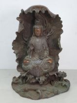 A bronze Figure of a Seated Guan Yin Buddha in Lotus Leaf, 10.5"High.